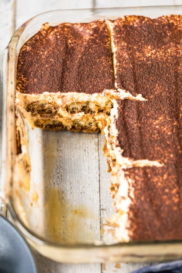 tiramisu in dish with slices cut out