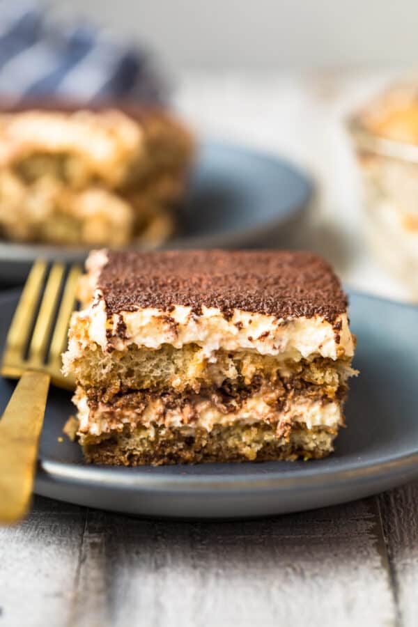 slice of tiramisu on black plate