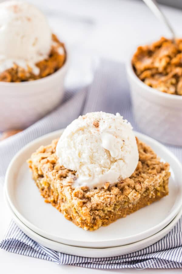 square of pumpkin crisp topped with ice cream