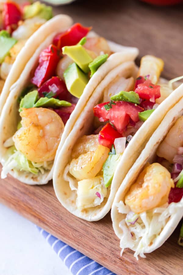 shrimp tacos garnished with pineapple slaw