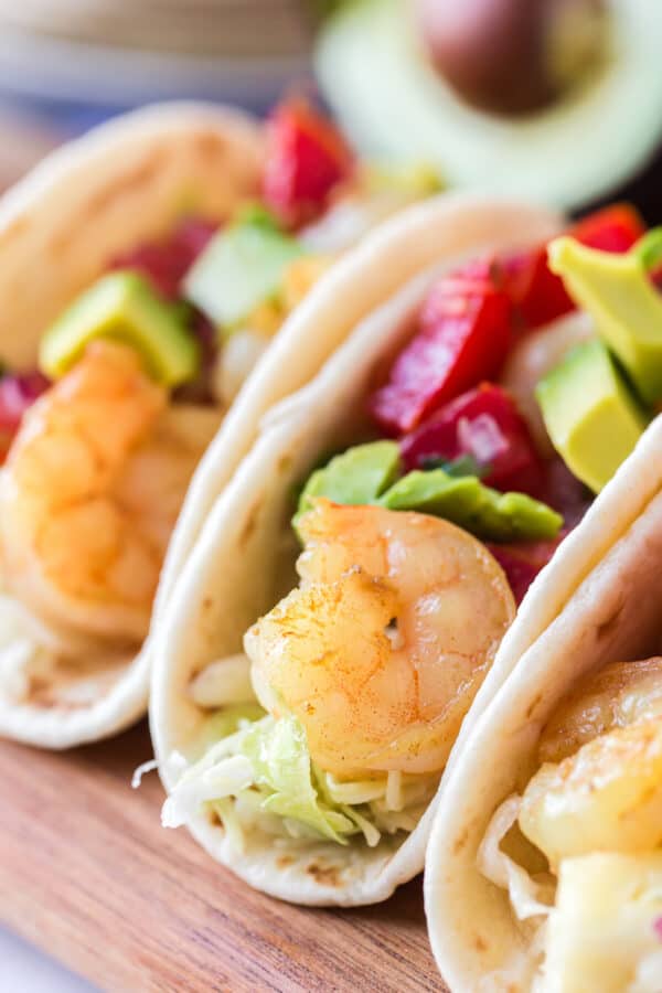 up close image of shrimp tacos with pineapple slaw