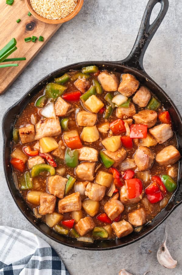 skillet filled with sweet and sour pork