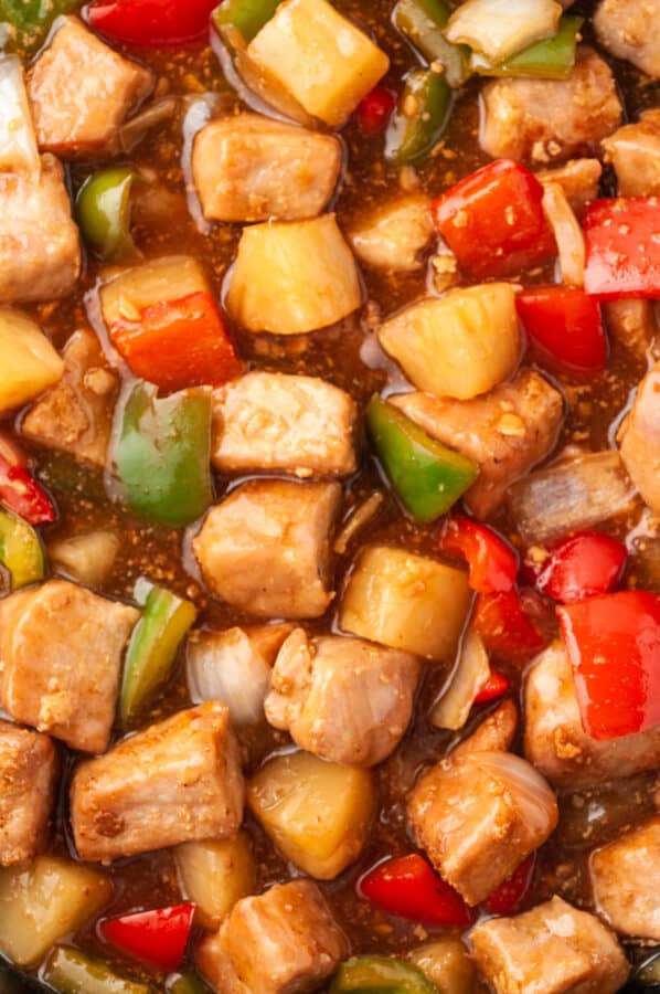 up close image of sweet and sour pork in sauce