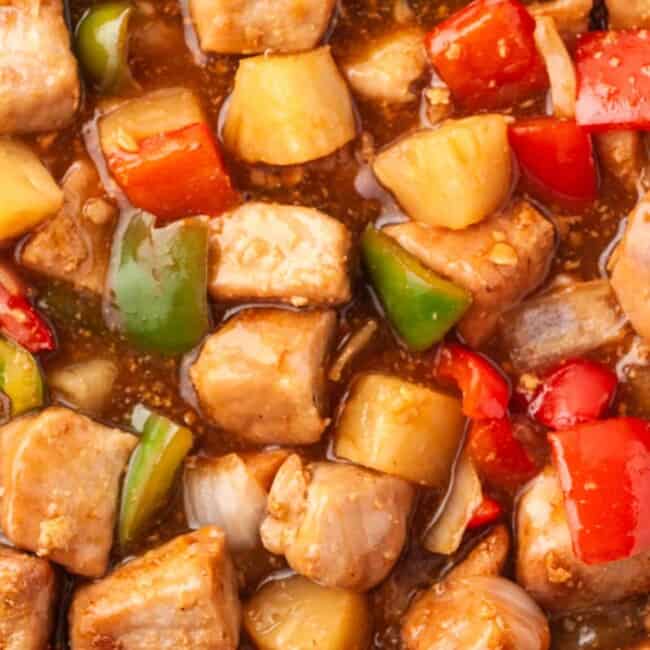 up close image of sweet and sour pork in sauce