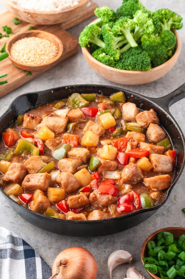 side image of skillet with sweet and sour pork with sauce