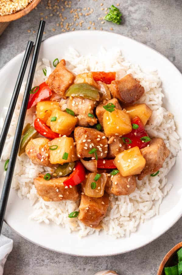 sweet & sour pork on plate over rice