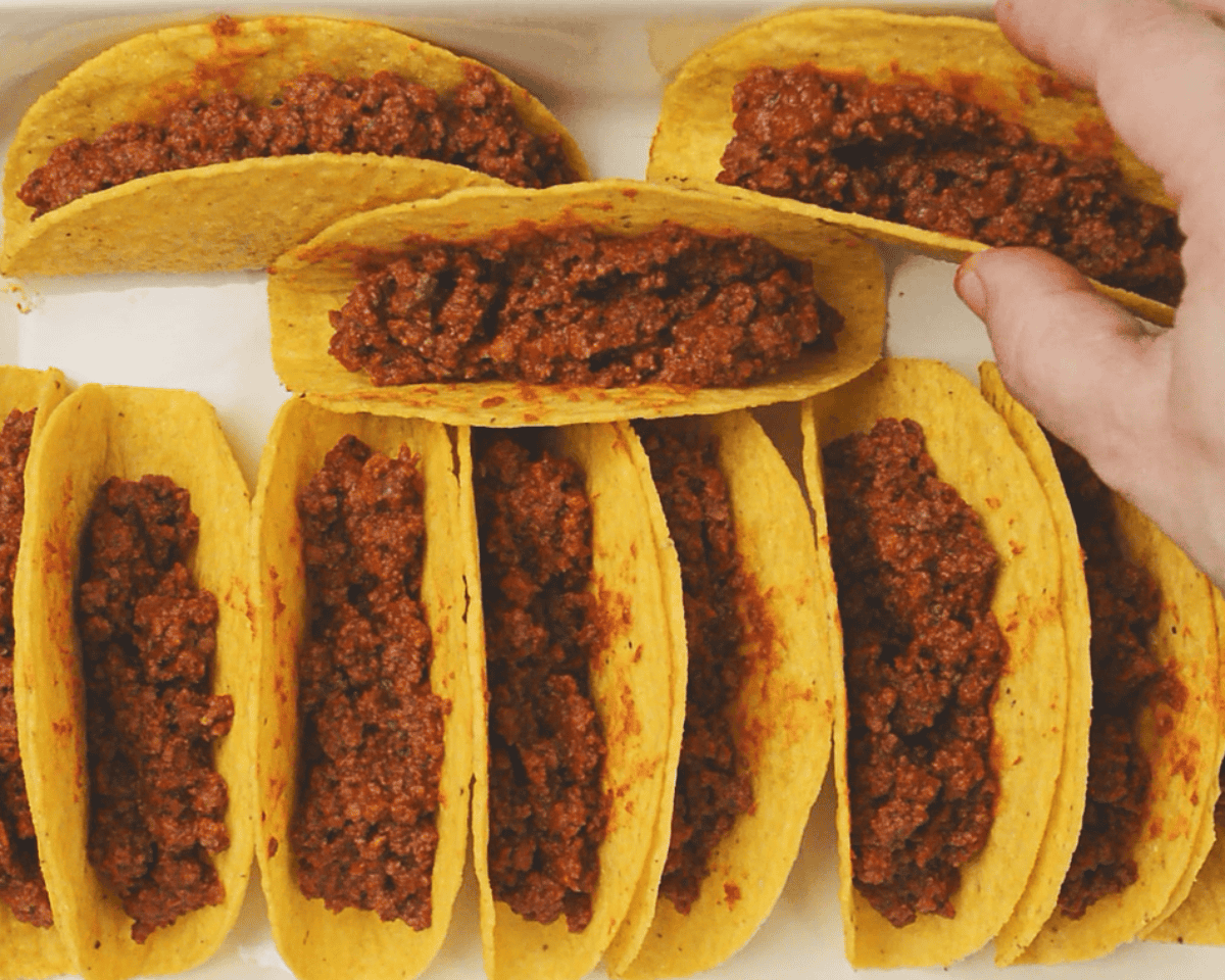 Ground beef filled taco shells in a casserole.