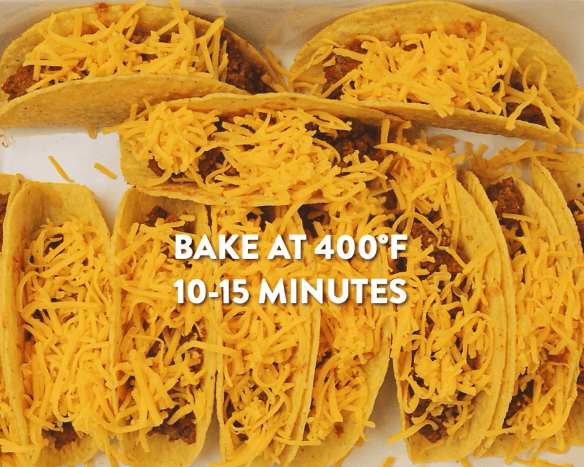 Ground beef tacos covered in cheese in a casserole dish.