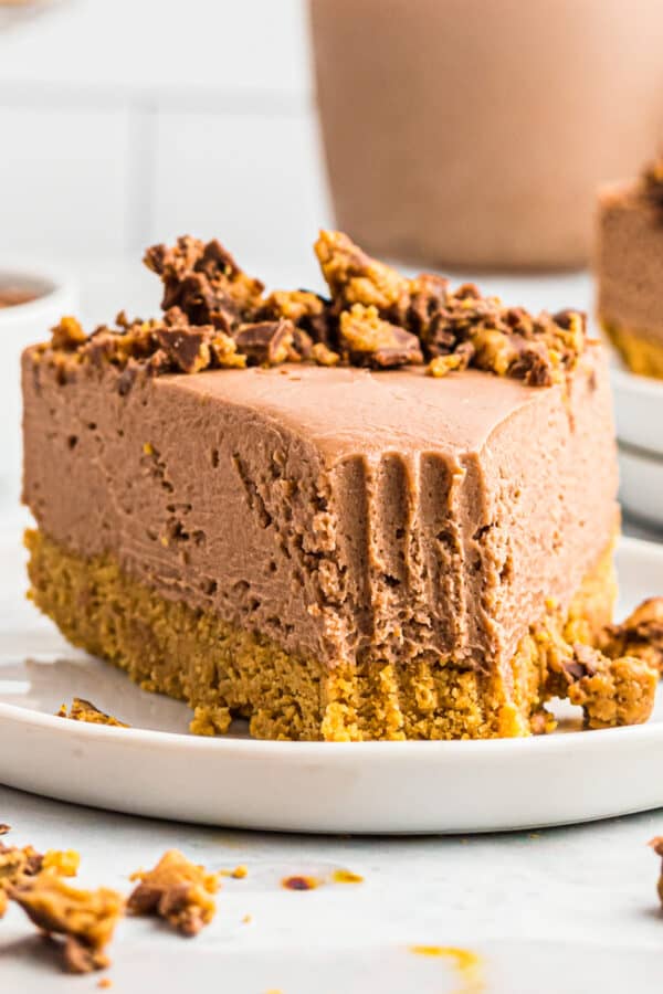 peanut butter cup no bake cheesecake on plate