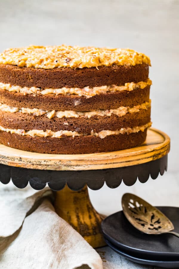 layered german chocolate cake on cake stand