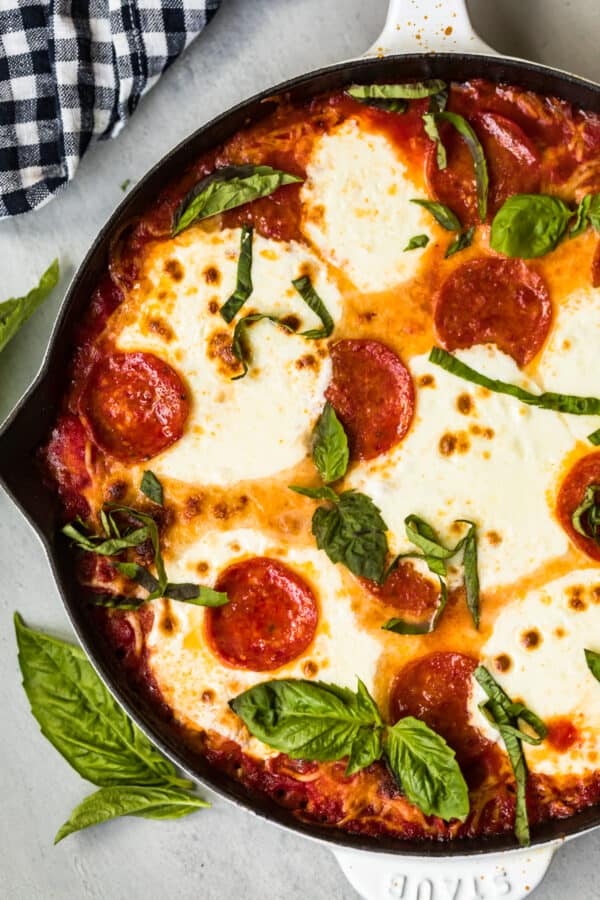 up close image of pepperoni pizza gnocchi bake in skillet