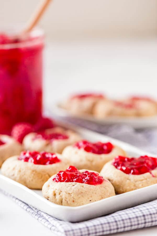 raspberry thumbprint cookies on platter