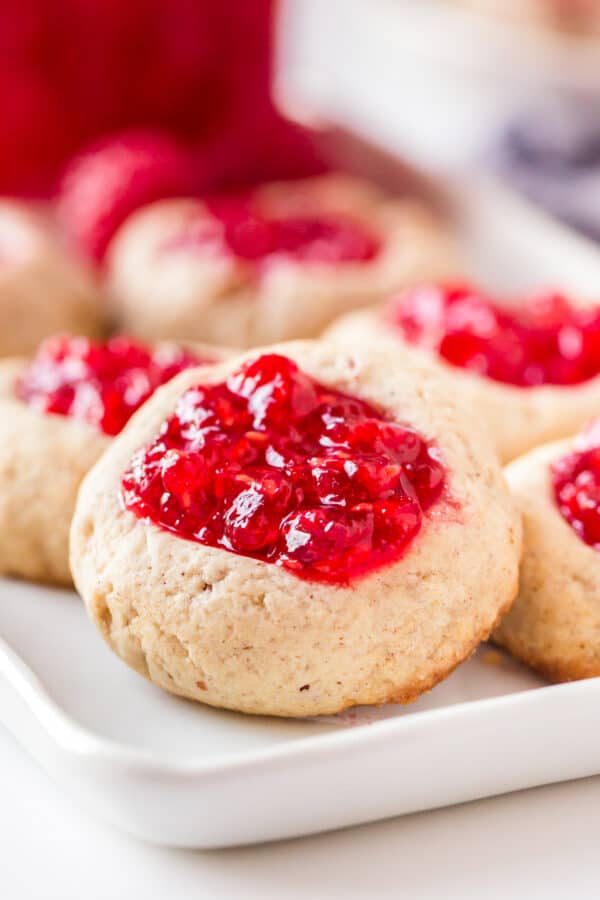 up close image of raspberry jam thumbprint cookies