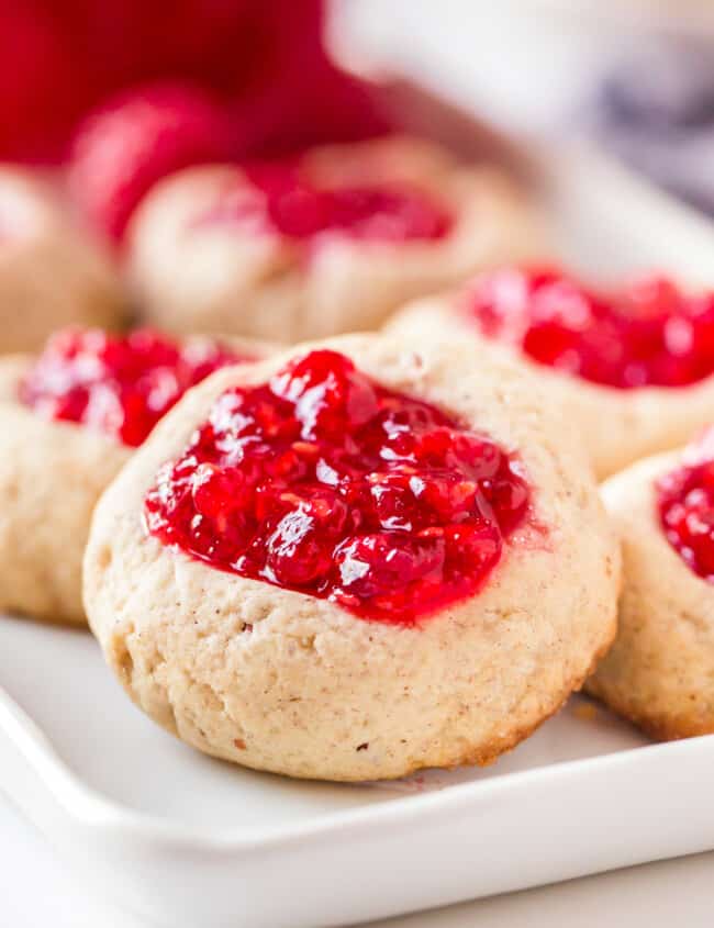 up close image of raspberry jam thumbprint cookies