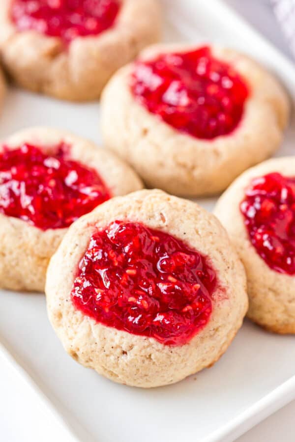 up close image of raspberry jam thumbprint cookies