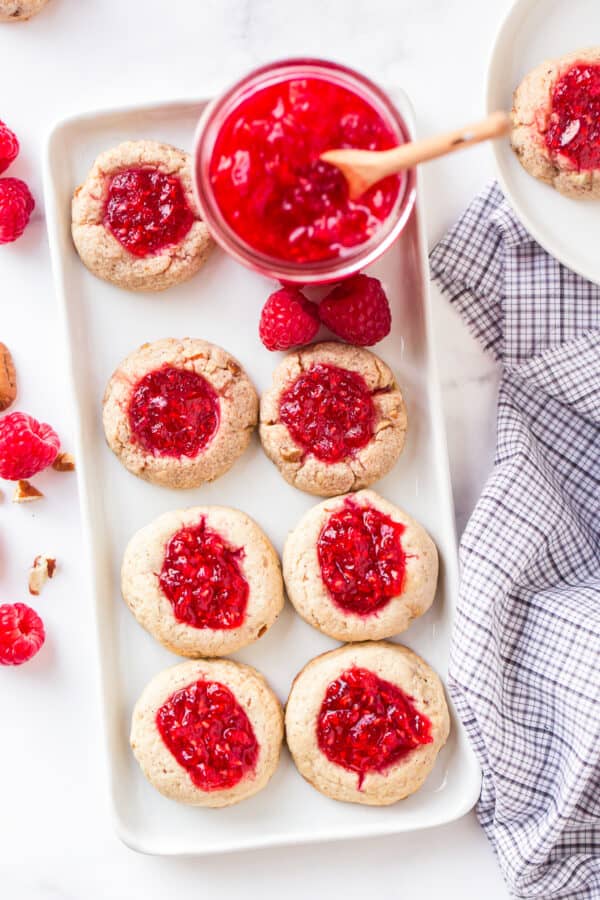 raspberry thumbprint cookies on platter