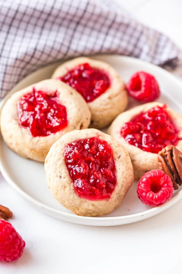 thumbprint cookies on white plate