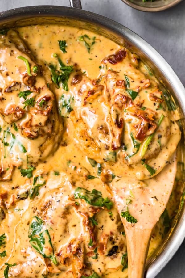 up close image of tuscan chicken in parmesan cream sauce