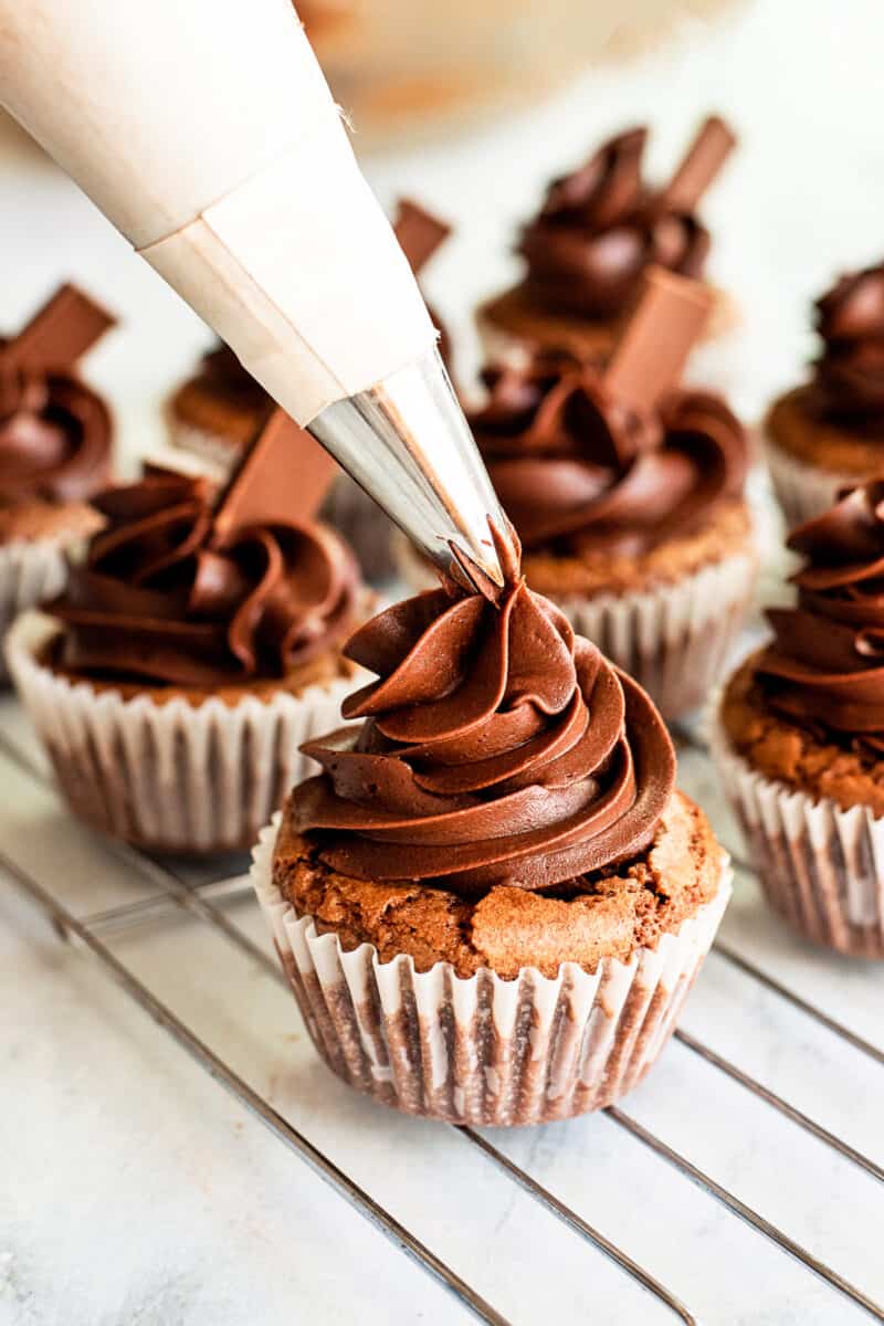 frosting brownie cupcakes with chocolate buttercream