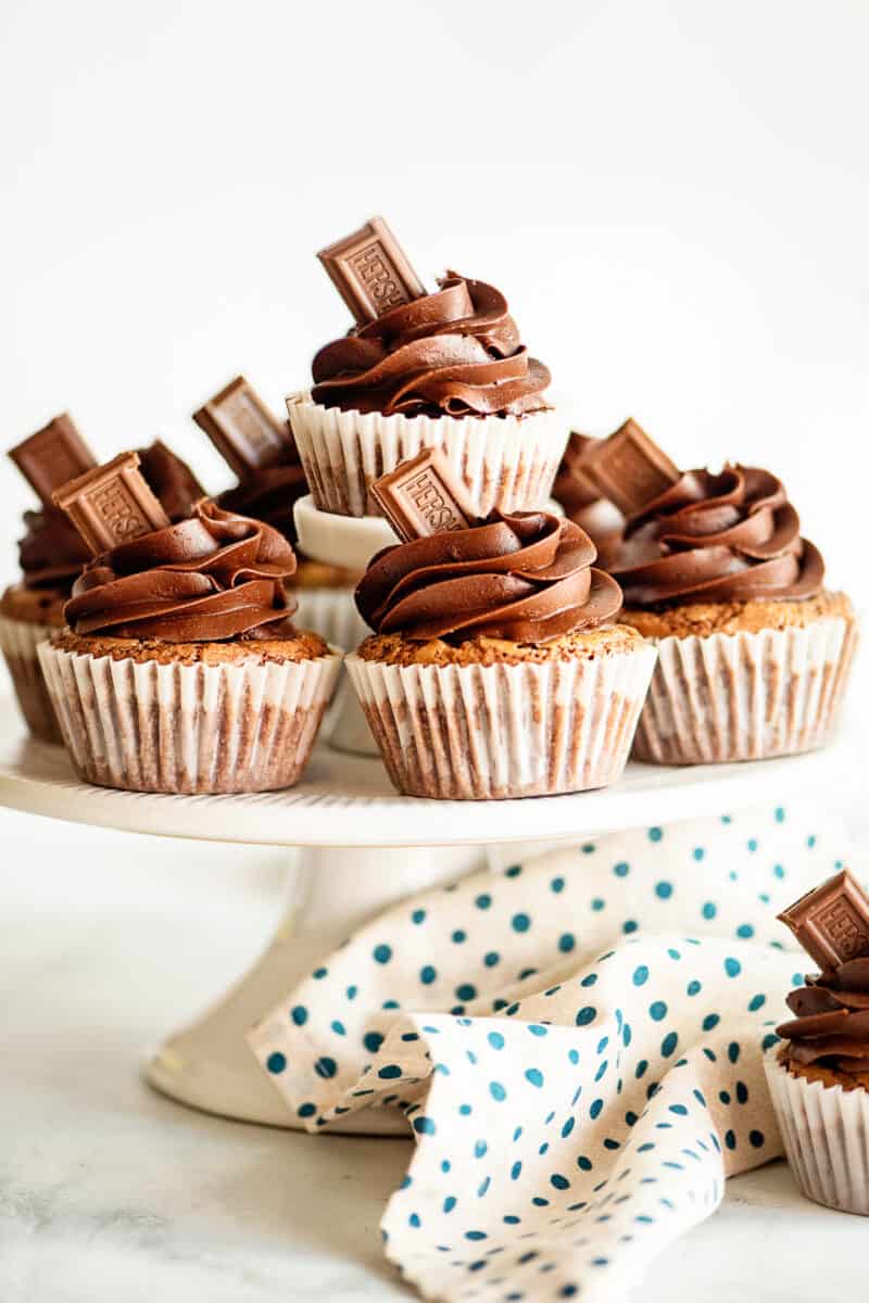 cake stand filled with brownie cupcakes