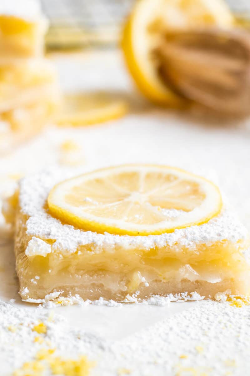 sliced lemon bar with lemon slice garnish