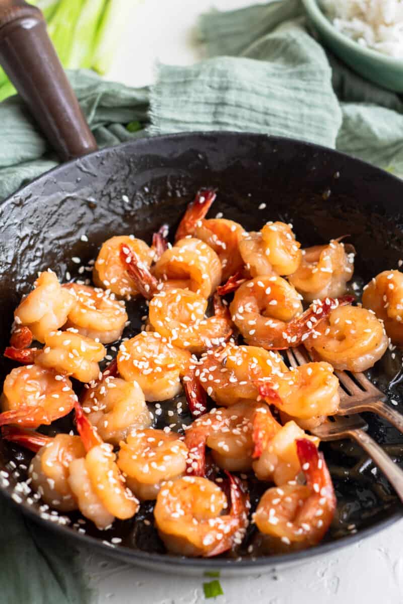 honey sesame shrimp in a skillet