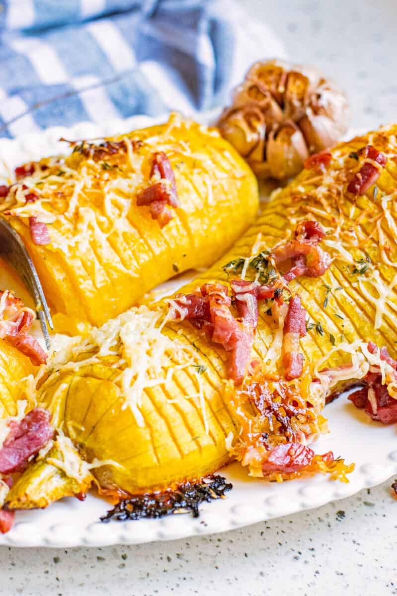 side shot of cooked squash on a dish.