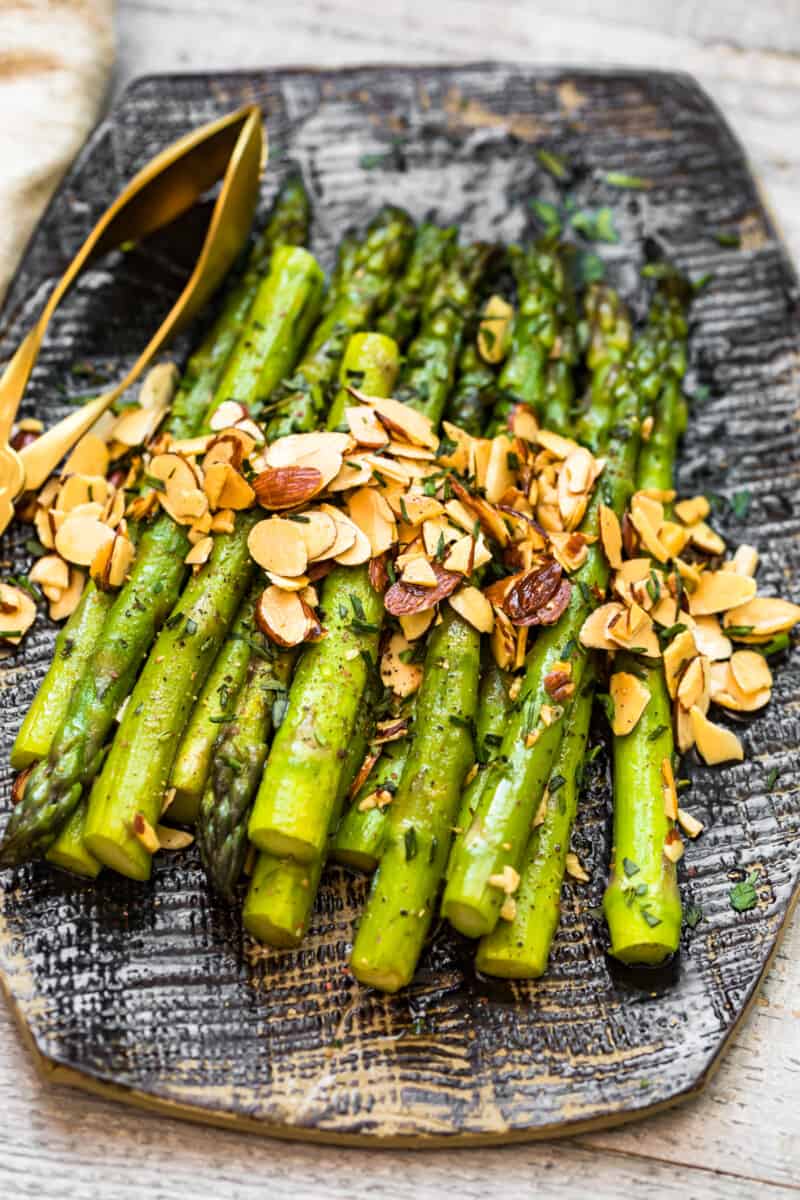 stems of asparagus topped with almonds