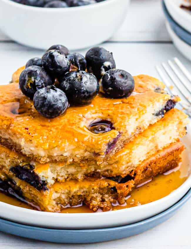 up close image of sheet pan blueberry pancakes with syrup