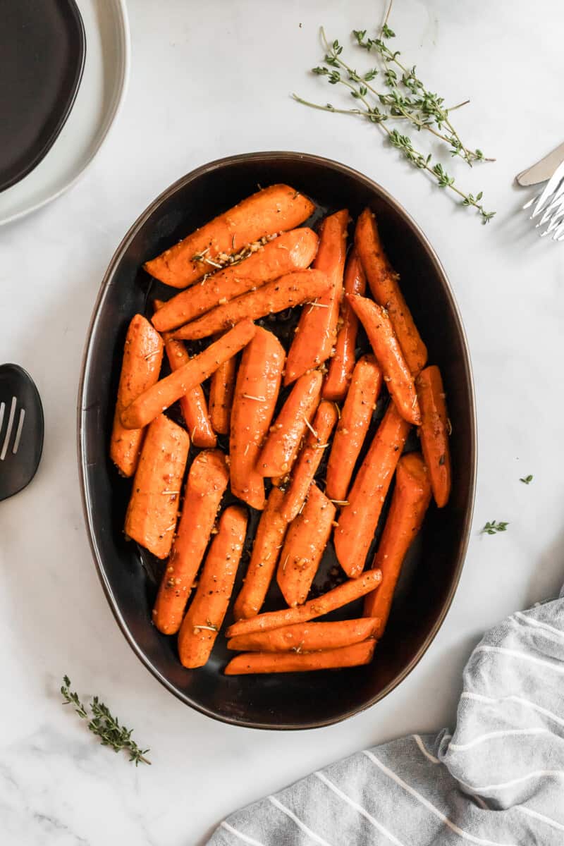 black serving dish with carrots