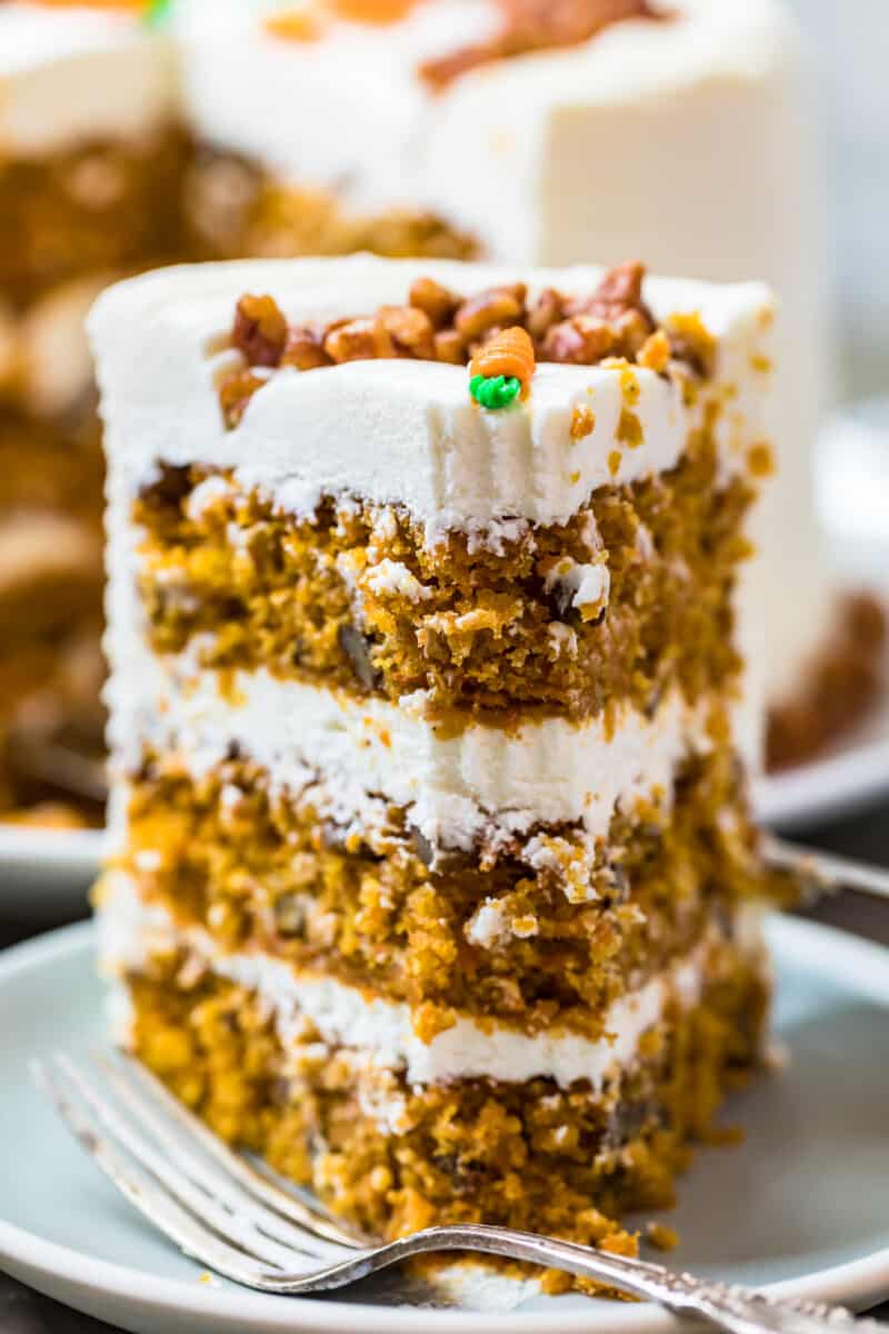 slice of carrot cake standing up on plate