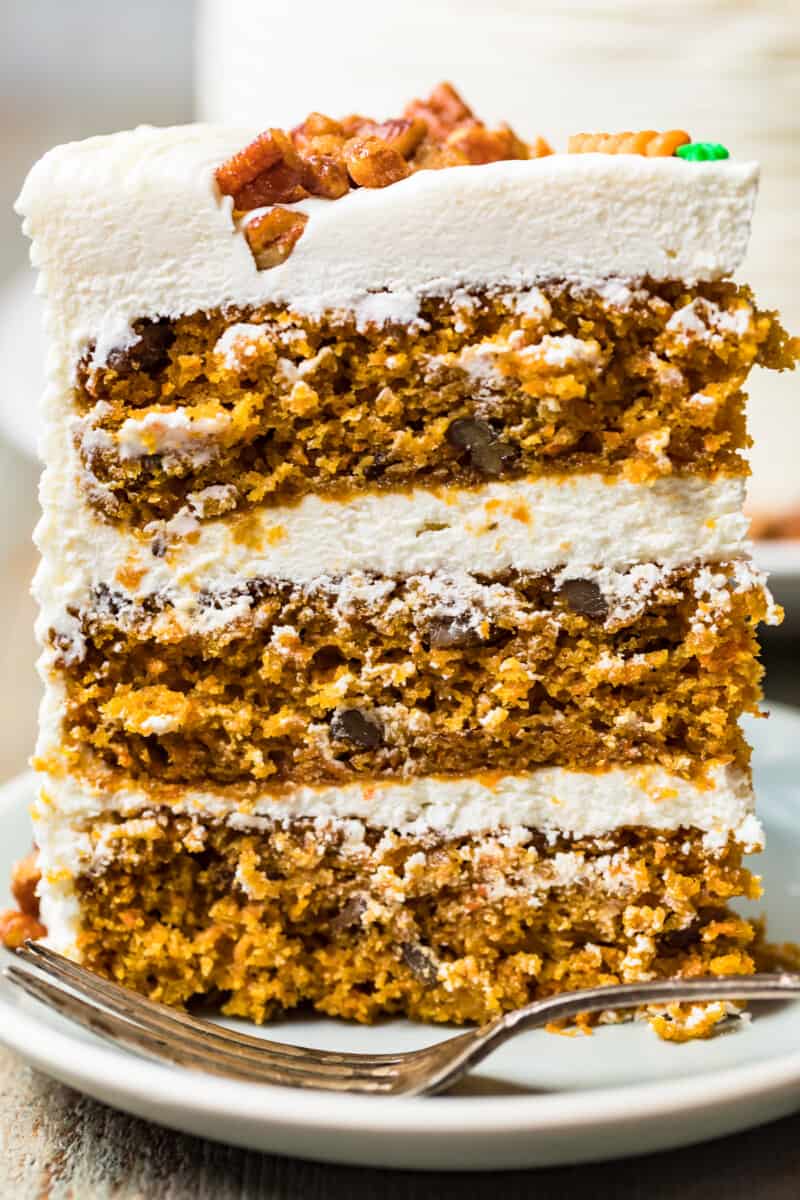 up close slice of carrot cake with three layers