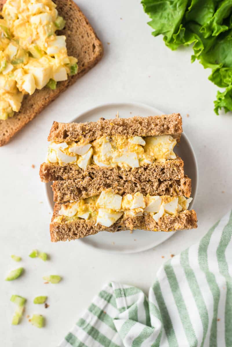 overhead image of egg salad sandwiches on plate