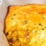 inside of loaded cornbread casserole with cheese and diced ham