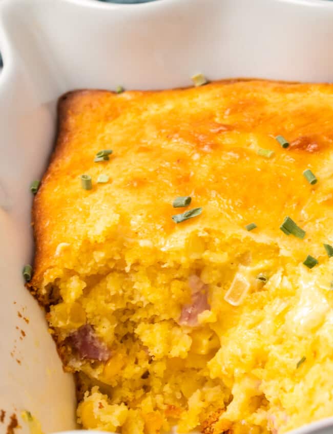 inside of loaded cornbread casserole with cheese and diced ham