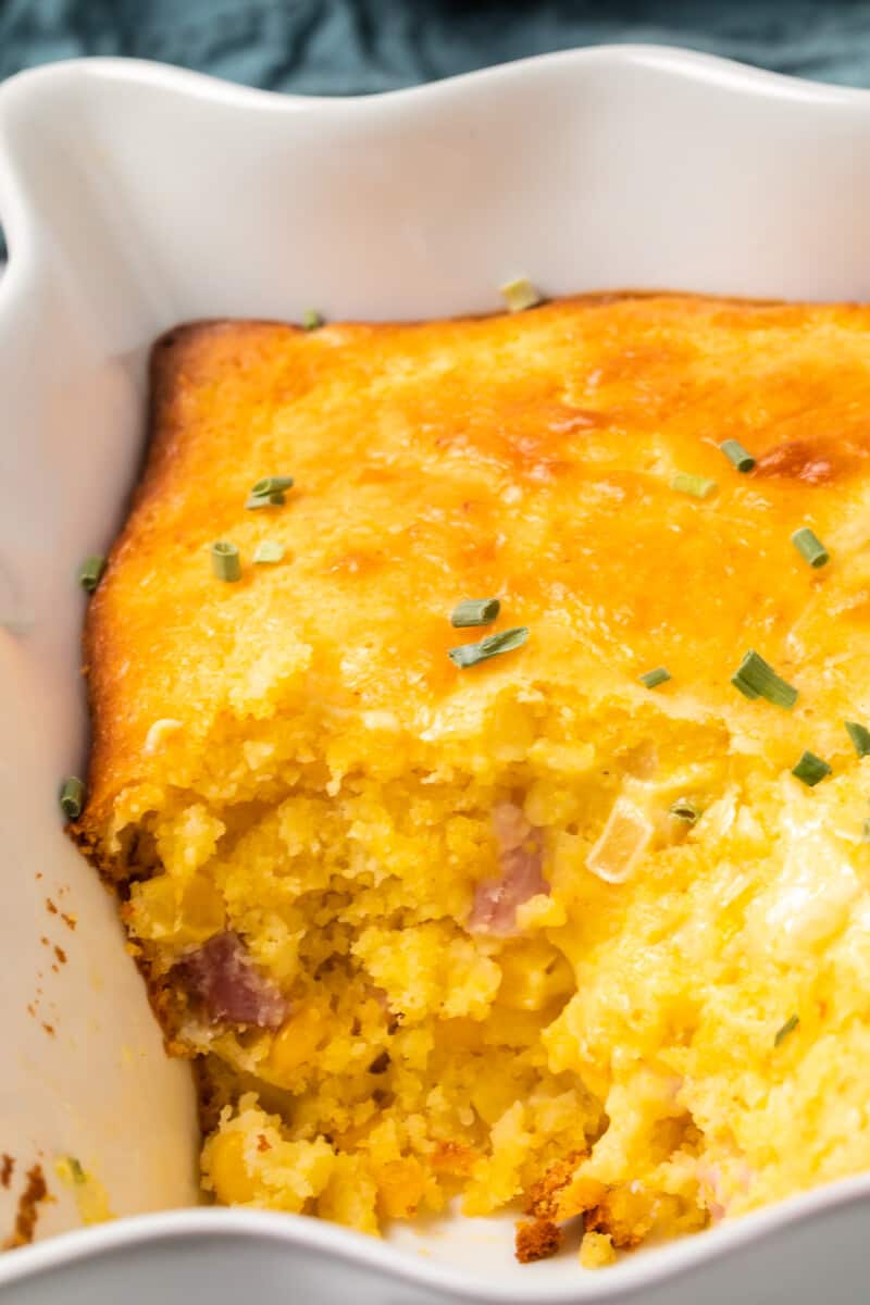 inside of loaded cornbread casserole with cheese and diced ham