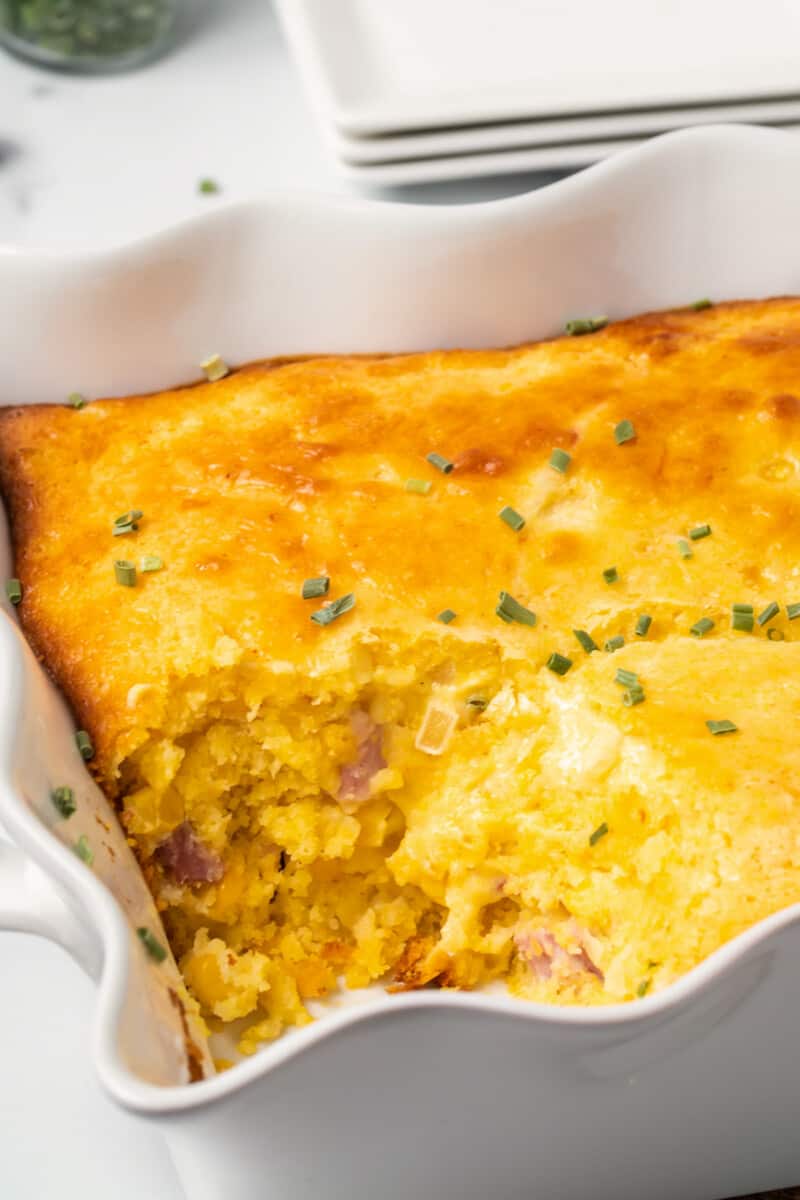 inside of loaded cornbread casserole with cheese and diced ham