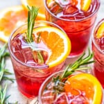 orange cranberry bourbon smash cocktails in glasses