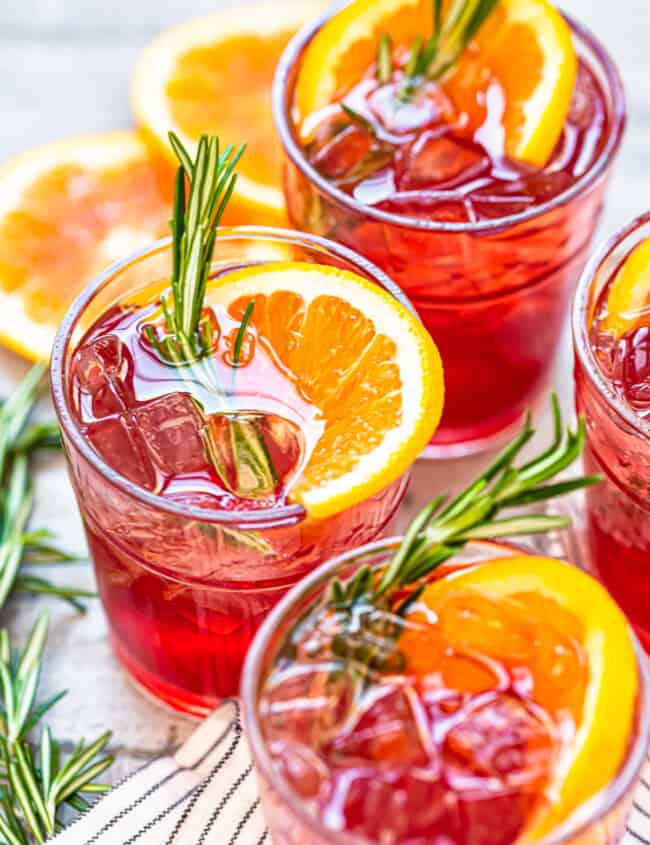 orange cranberry bourbon smash cocktails in glasses