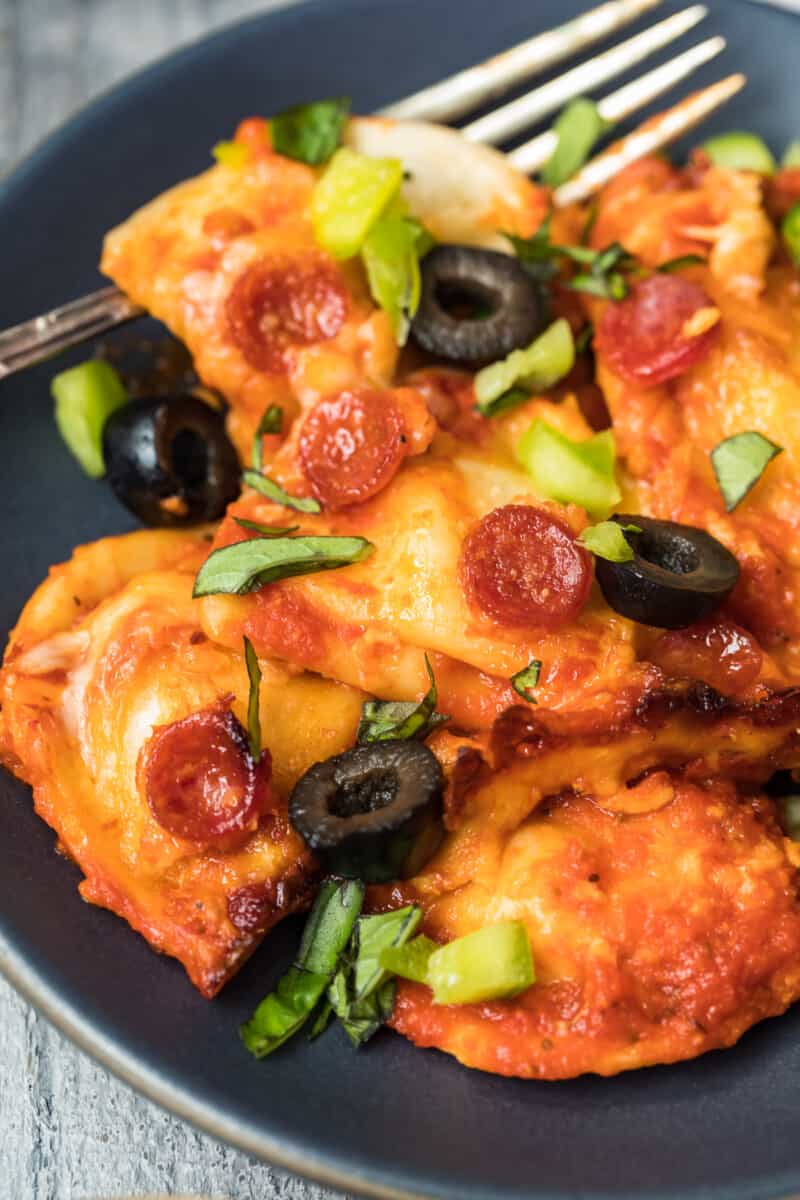 plated pizza pierogy casserole with olives and green pepper toppings