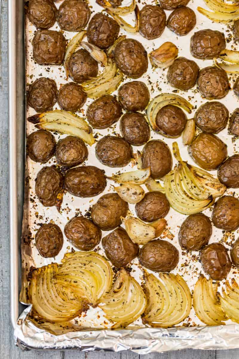 roasted red potatoes with onion on sheet pan