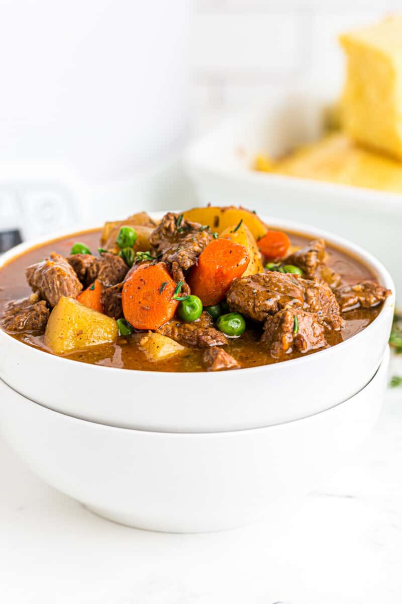 slow cooker beef stew in white bowl