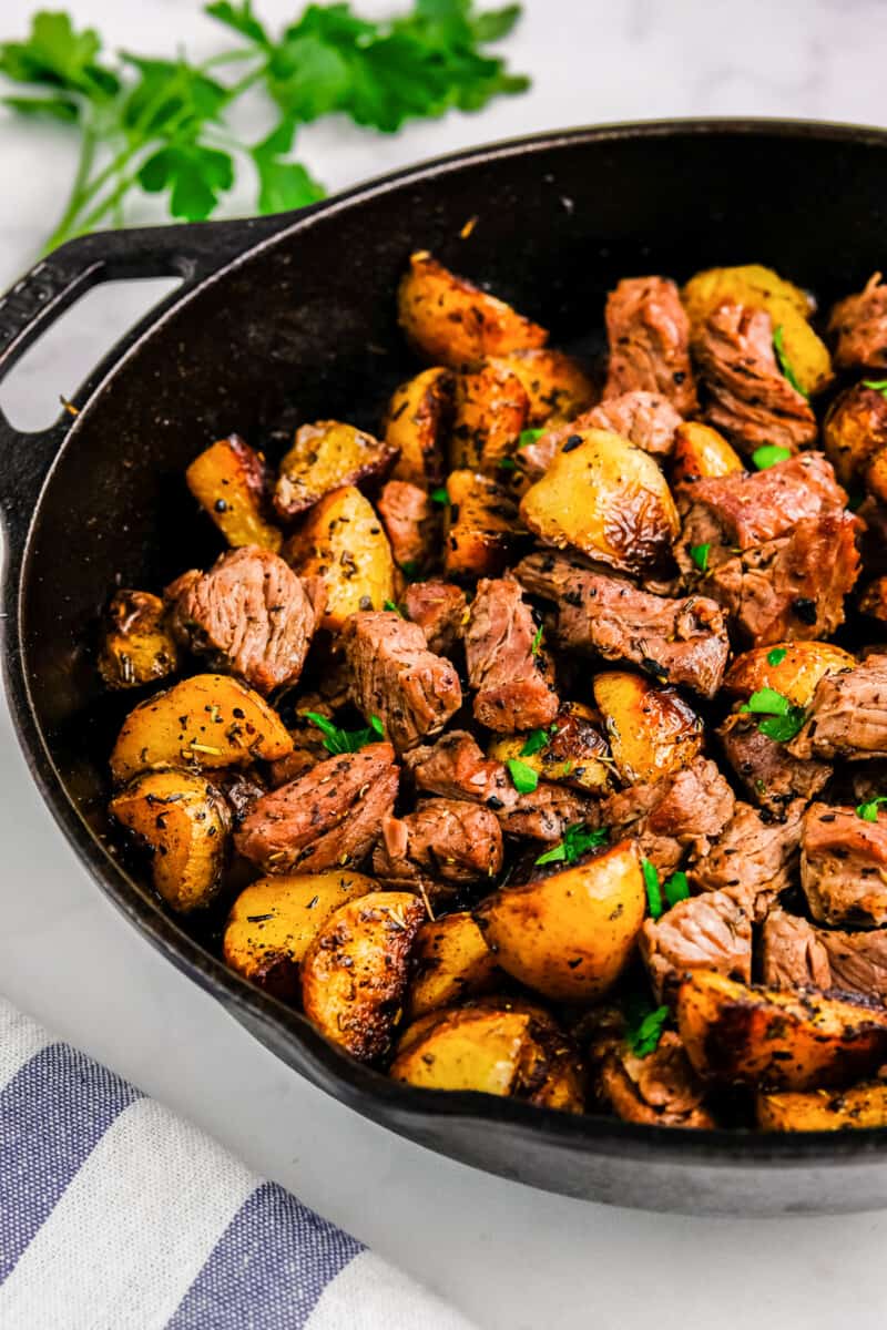 garlic steak and potatoes in skillet