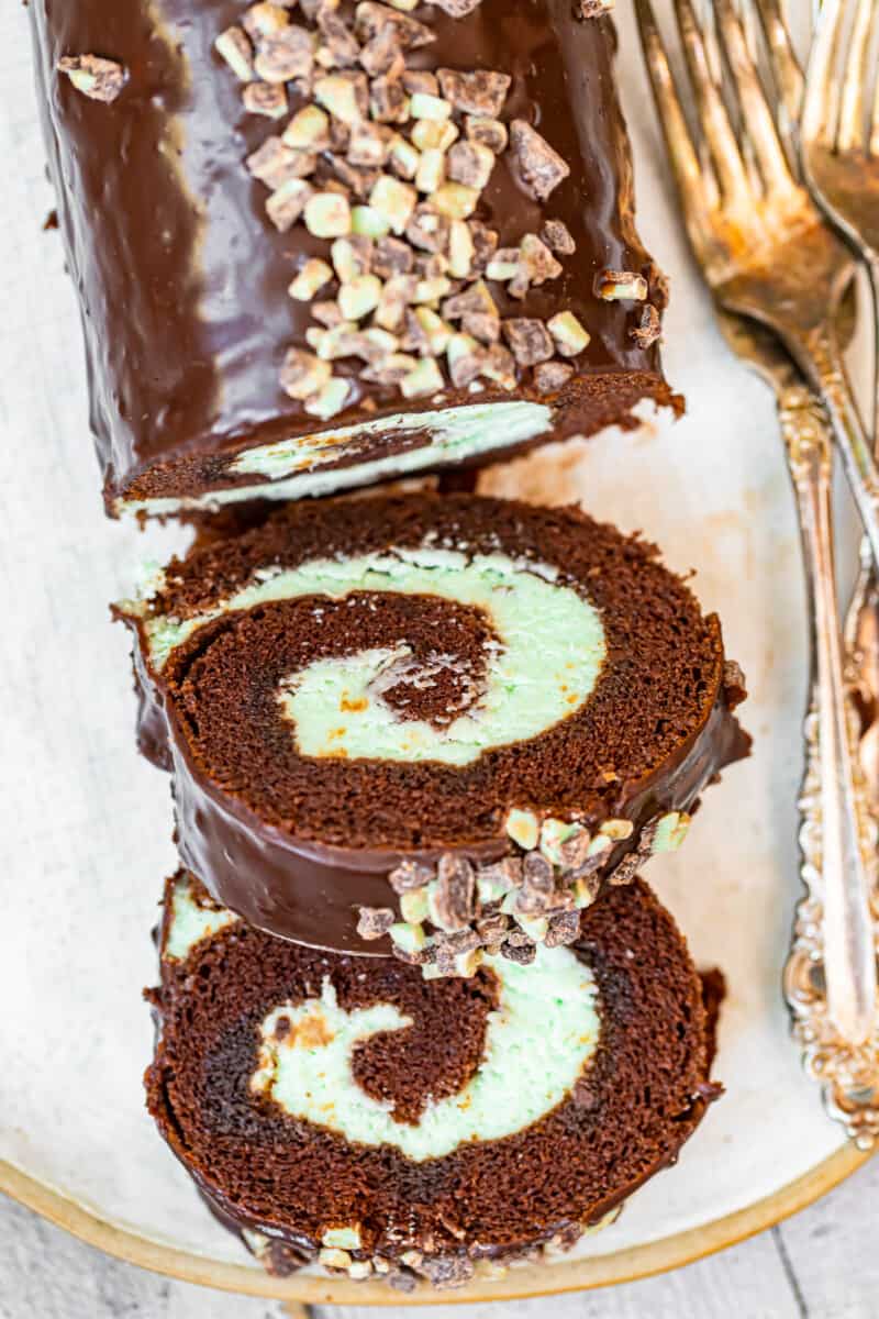 mint chocolate swiss roll sliced on white plate