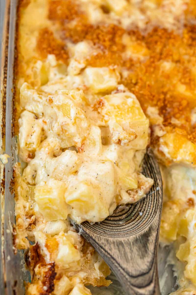 spoon digging into parmesan creamed potatoes