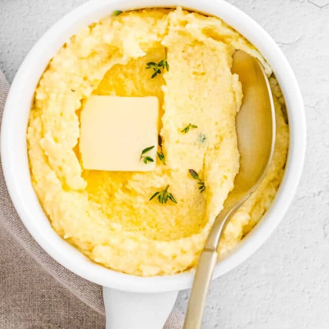 spoon digging into parmesan poletna