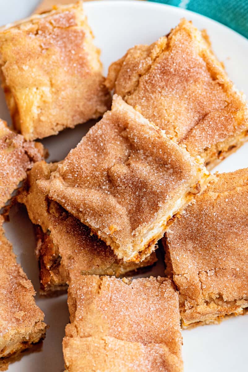 snickerdoodle cheesecake bars cut on plate