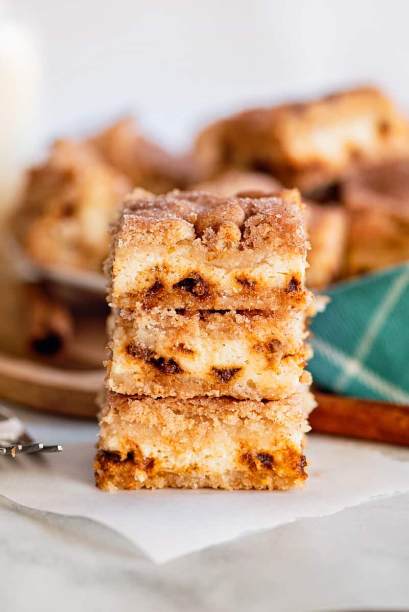 snickerdoodle cheesecake bars sliced and stacked