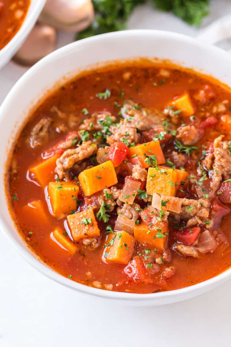 up close photo of white bowl with chili made with sweet potato