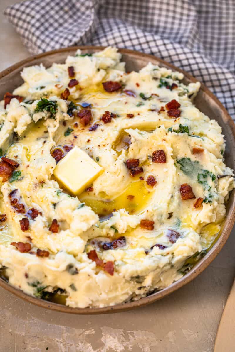 colcannon potatoes in bowl garnished with bacon